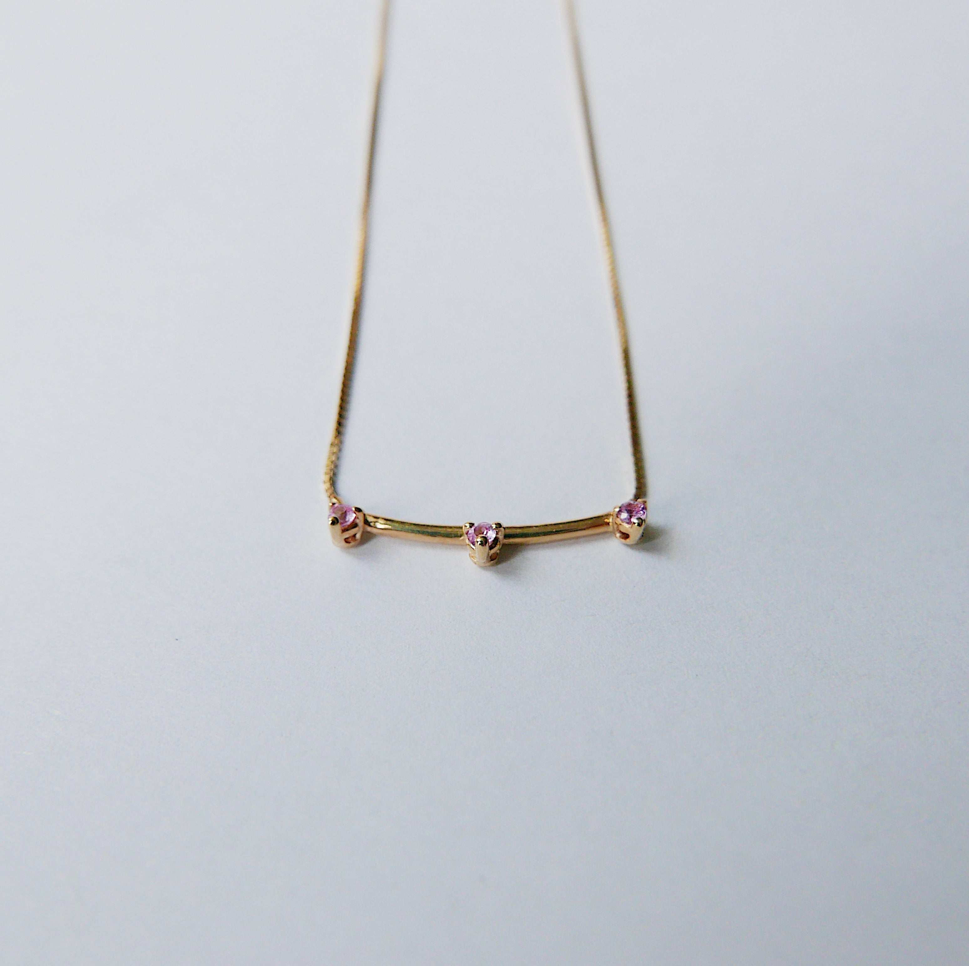 Simple staple everyday necklace with a pop of color.  Normally $580  Details: Pink Sapphires measures about 1.7mm Total necklace length is 16.75 inches  14k Yellow Gold  Free Shipping on Domestic Orders over $50  Materials: 14 yellow gold