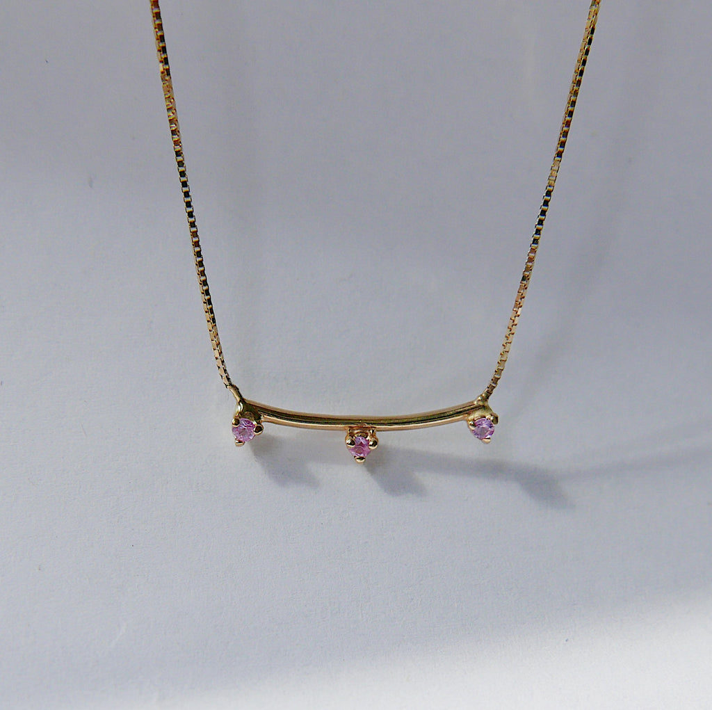 Simple staple everyday necklace with a pop of color.  Normally $580  Details: Pink Sapphires measures about 1.7mm Total necklace length is 16.75 inches  14k Yellow Gold  Free Shipping on Domestic Orders over $50  Materials: 14 yellow gold