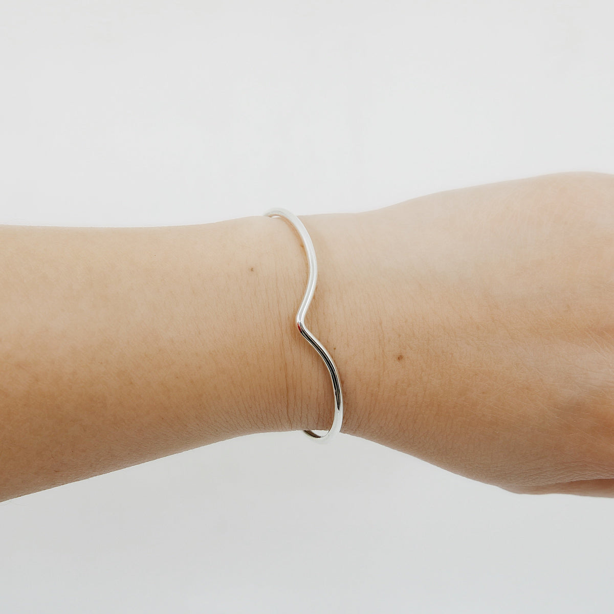 On hand of Chevron Bracelet, Sterling SIlver
