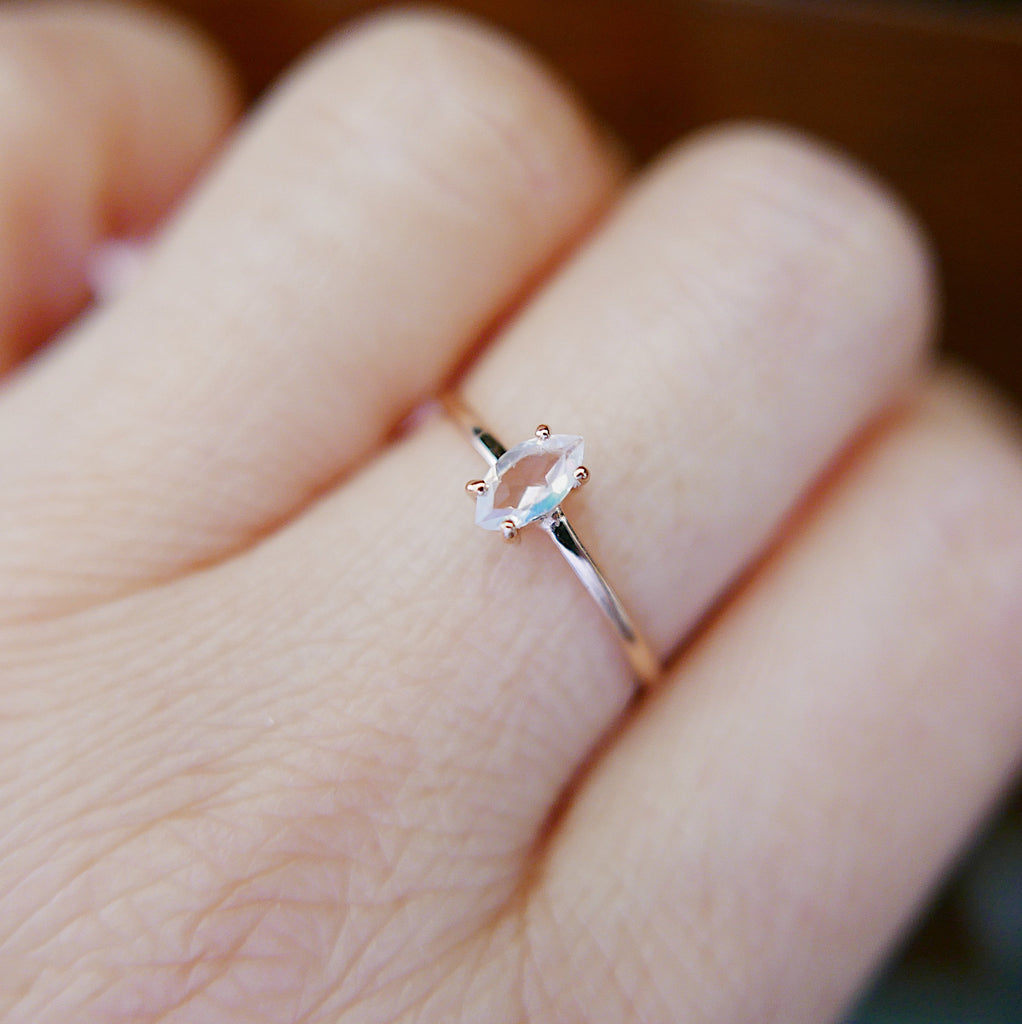 Solitaire Rings  sleek ring  Rings  moonstone ring  moonstone marquise  minimalist  mgj  mason grace jewelry  mason grace  marquise shaped ring  marquise ring  marquise moonstone  marquise cut  jewelry  glowing stone ring  fine jewelry  ethereal ring  dainty ring  blue ring  birthstone ring